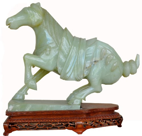 Carved light green jade Tang style horse sculpture